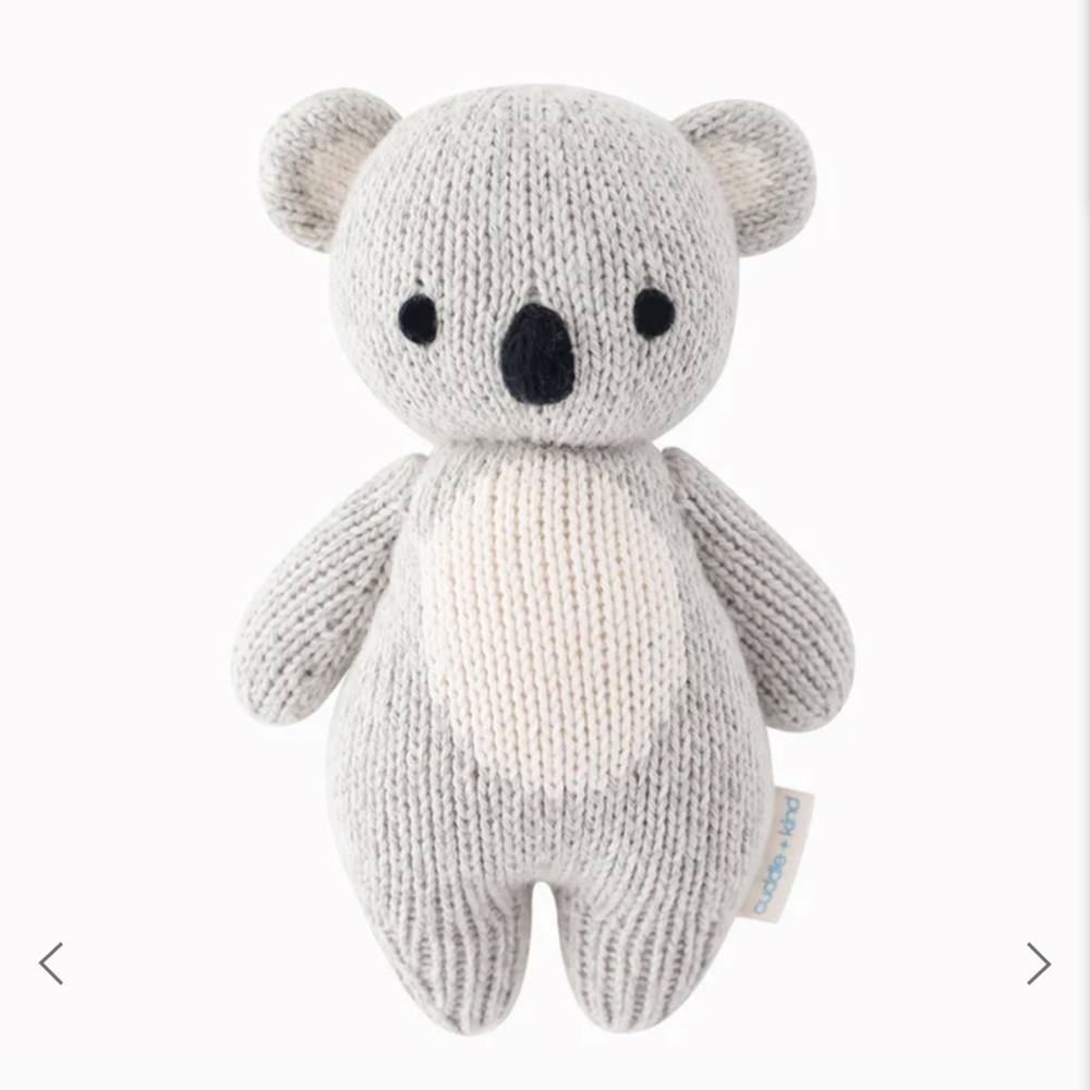 Cuddle and kind baby koala